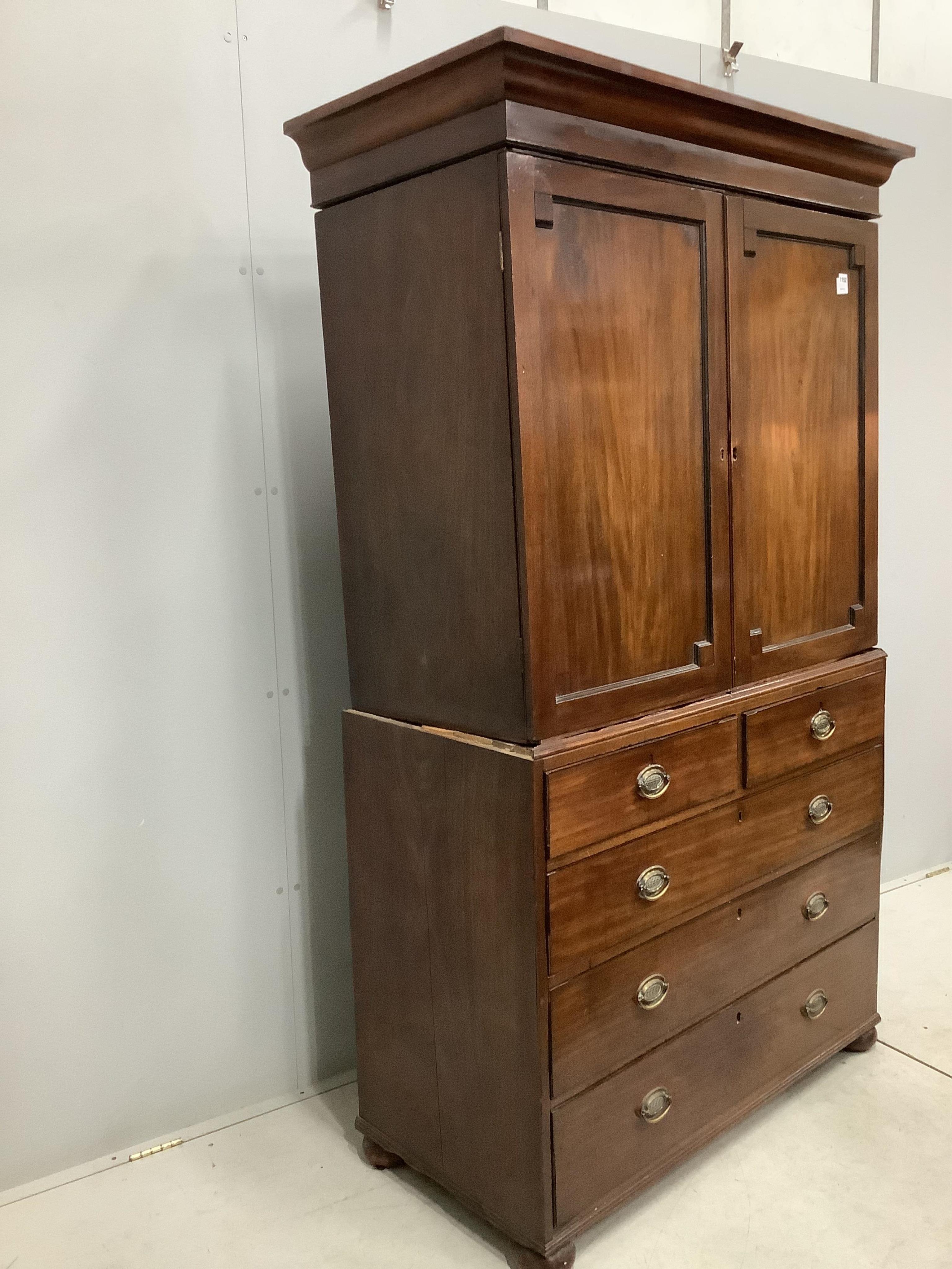 A Regency mahogany linen press, width 114cm, depth 53cm, height 200cm. Condition - poor